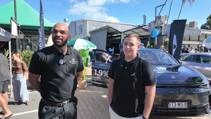 Adam talking to a Leap Motor representative about the new C10 at the Noosa EV Expo